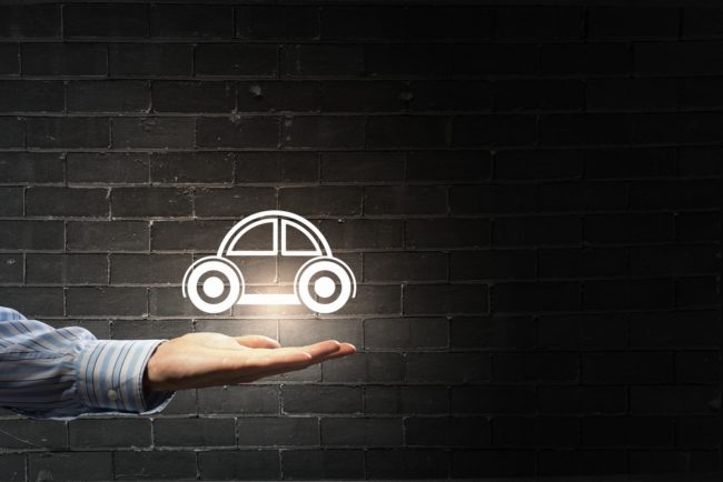 Close-up-of-male-hand-showing-car-sign-650x434.jpg